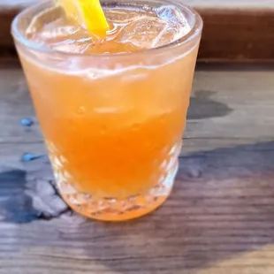 a drink in a glass on a table