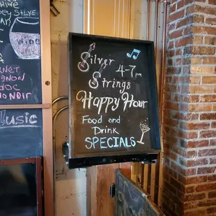 a sign for a happy hour