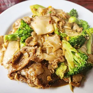 beef and broccoli on a white plate