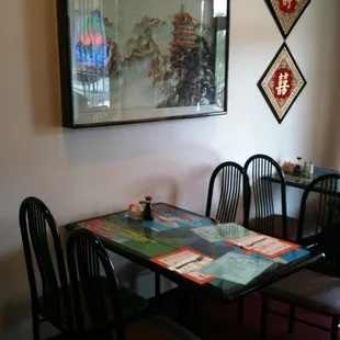 a dining room with a table and chairs