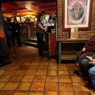 a group of people sitting in a restaurant