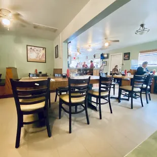 a dining room with tables and chairs