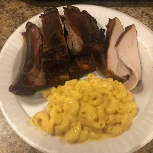 Pork ribs, Sliced turkey, and Mac and cheese