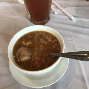 a bowl of soup and a drink