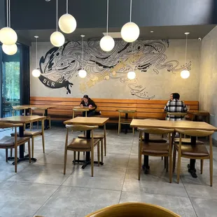 a man sitting at a table in a restaurant