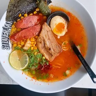 a bowl of ramen and a spoon