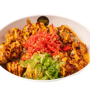 Chicken Kaarage Bowl - Soy garlic marinated chicken, deep fried, over fresh white rice with spicy aioli and teriyaki drizzle!