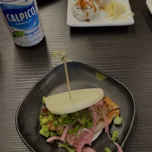 Pork Bun, Shrimp Tempura Cut Roll, and Calpico