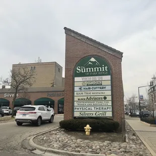 Strip mall signage and storefront, circa Feb 2024.