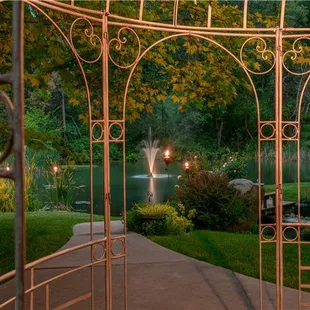 Beautiful gazebo and pond with water feature.