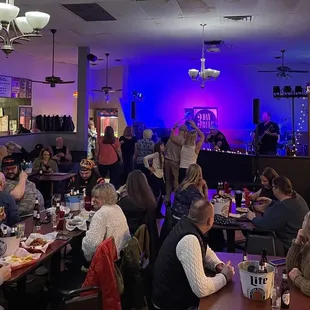 a large group of people sitting at tables