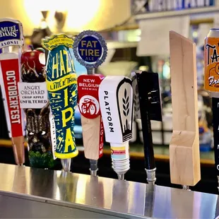a row of beer taps