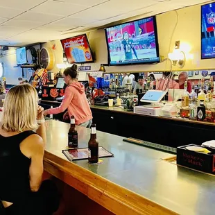 people sitting at the bar