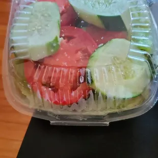 a salad in a plastic container