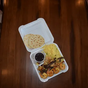 a meal in a styrofoam container