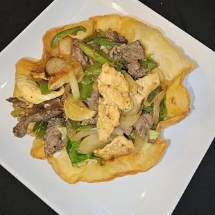 Steak and chicken taco salad