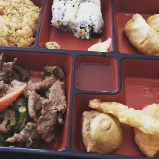 a bento box of food
