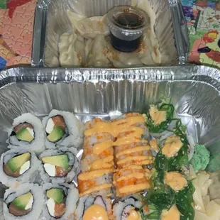 Steamed Gyoza in top tray bottom from left to right: Philly Roll , Spicy California Roll , Sweet Sweet and Sour Roll Special