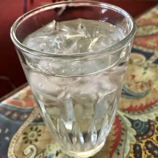 Glass of water with ice when you sit down
