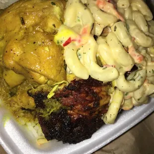 Small curry chicken x jerk chicken, white rice &amp; macaroni salad.