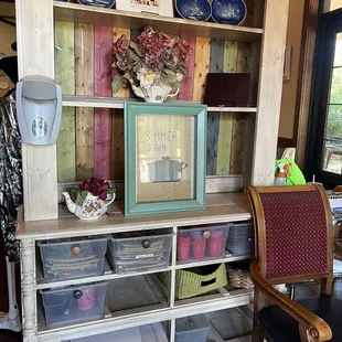 a room with a chair and a bookcase