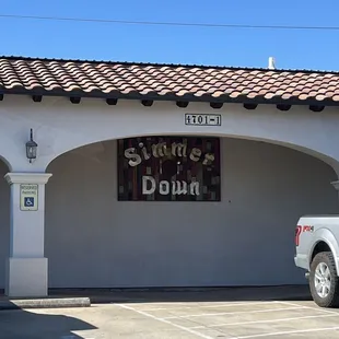 a truck parked in front of a building