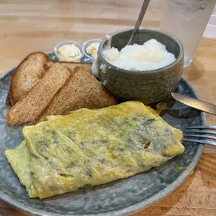 Veggie omelette, grits and wheat toast