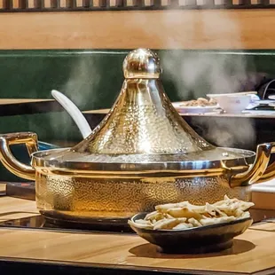 a hot pot on a table in a restaurant