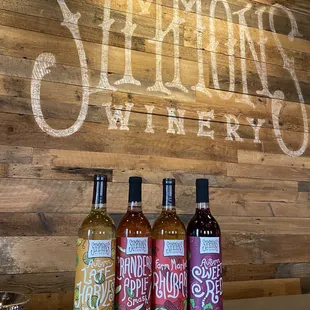 three bottles of wine on a counter
