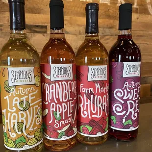 three bottles of wine on a table