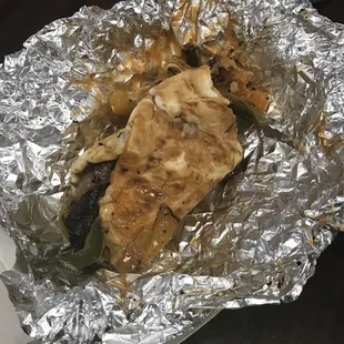 a burrito wrapped in foil