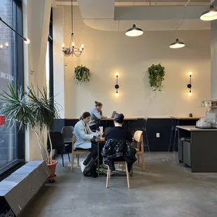 a group of people sitting at a table