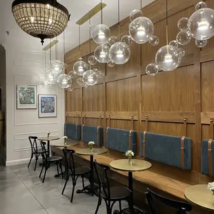 a restaurant with a long table and chairs