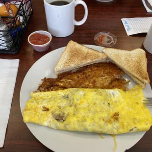 Sausage, mushroom and cheddar omelette with toast, hash browns and side of salsa.