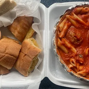 Penne with meatballs and garlic bread. Good sauce.