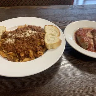 Penne with meat sauce, sausage, bread.