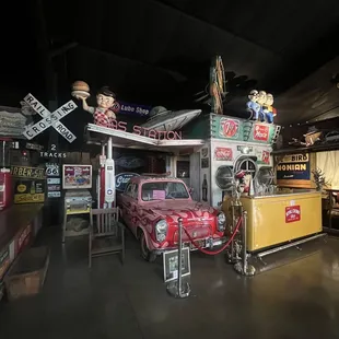 Kiosks with decor and carnival style games to the left.
