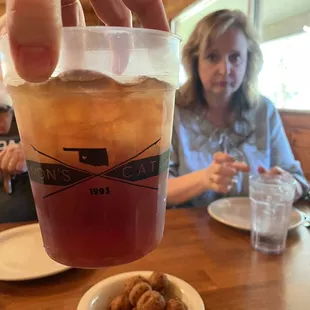 Souvenir cup, hush puppies, mom