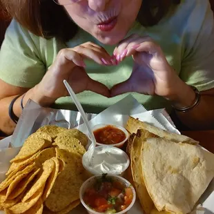 a woman eating a plate of food