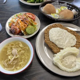 Chicken Fried Steak, mashed potatoes with white gravy, chicken noodle soup, side salad