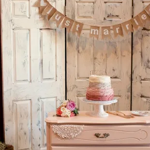 Such a perfect wedding cake display in the barn - all thanks to Simple County Wedding&apos;s