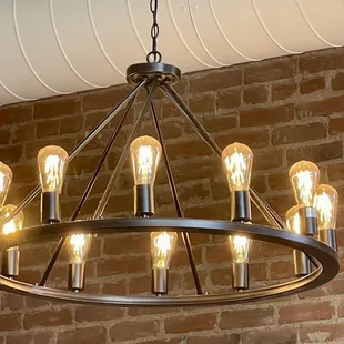 a circular chandelier with light bulbs