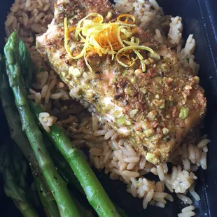 Pistachio encrusted salmon served over citrus risotto with a side of asparagus