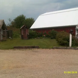 a red barn with a white roof