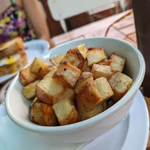 a bowl of potatoes on a plate