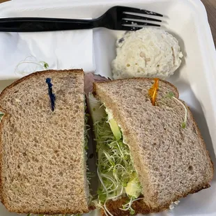 a sandwich in a styrofoam container