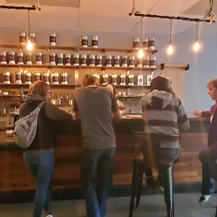 a group of people sitting at a bar