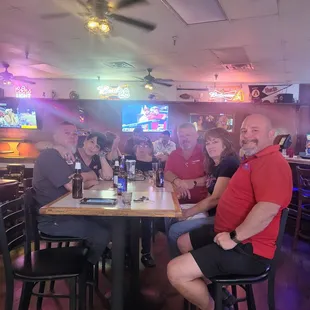 a group of people sitting at a table