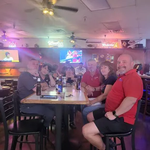a group of people sitting at a table