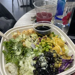 a plate of salad and a drink